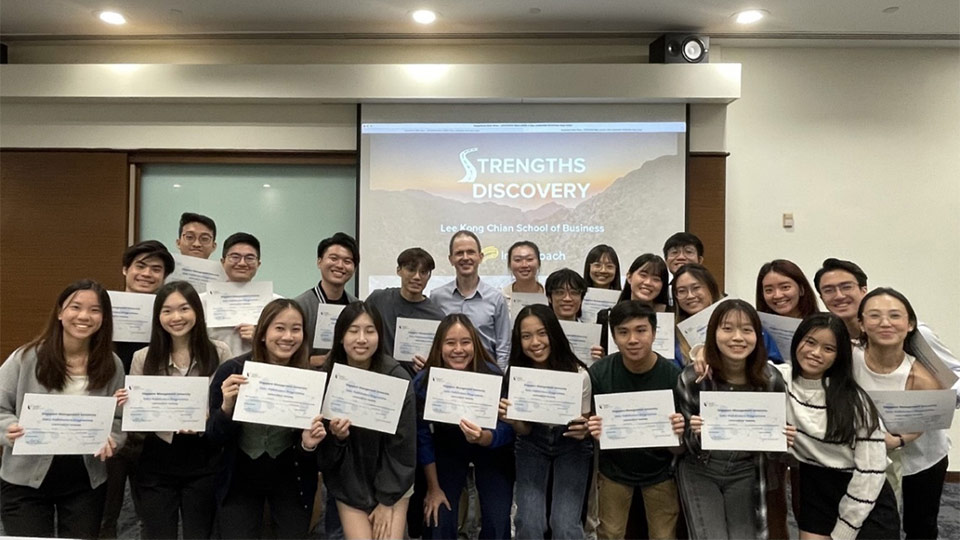 Lee Kong Chian School of Business (LKCSB) students holding up their certificates to commemorate the end of the ‘LKCSB Student Leadership Training’ programme